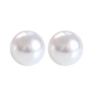 Close-up of white ABS imitation pearl beads with direct holes for DIY jewelry crafting.