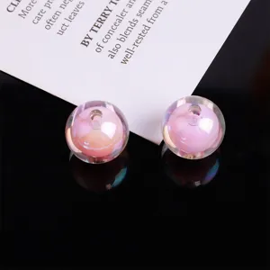 Close-up of AB color bead-in-bead acrylic DIY jewelry material, showing glossy pink iridescent texture.