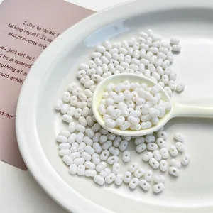 White acrylic peanut beads detail display, excellent materials for handmade DIY bracelet crafting.