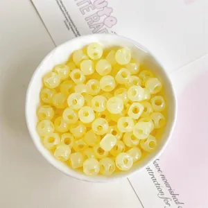 Yellow translucent acrylic barrel beads for DIY jewelry making, phone charms and bracelets.