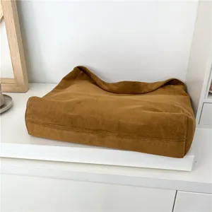 Brown vintage suede shoulder bag minimalist large capacity tote bag detail view.