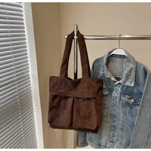Brown corduroy tote bag for women, large capacity shoulder handbag with front pockets.