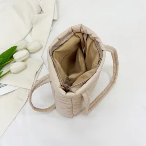 Soft quilted nylon tote bag for women, casual puffer shoulder bag with interior zipper pocket.
