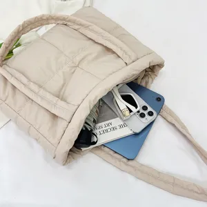 Quilted nylon tote bag for women, soft down shoulder handbag with spacious interior capacity.