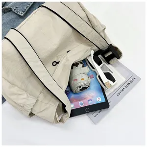 Casual minimalist nylon shoulder bag, large capacity workwear style messenger bag for daily use.