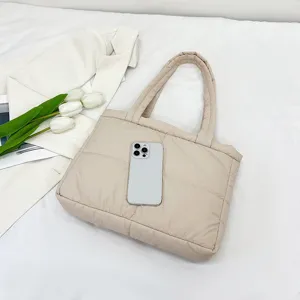 Beige nylon quilted tote bag for women, soft puffer shoulder bag with stylish grid design.