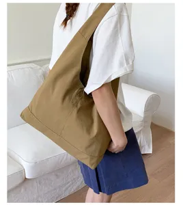 Detail view of the casual canvas shoulder tote bag with cute bow, perfect for daily wear.