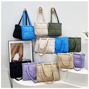 Details of nylon padded tote bags in various colors showing soft quilted grid texture.