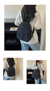 Casual nylon mini backpack for women, stylish black daypack with large capacity for daily commute.