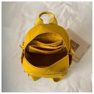 Lightweight nylon mini backpack for women, casual bright yellow school bag with multi pockets.