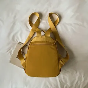 Yellow nylon small backpack casual minimal daypack travel school book bag lightweight