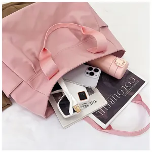 Large capacity pink nylon tote bag for women, casual shoulder and stylish commuting handbag.