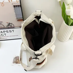 Large capacity corduroy tote bag with interior compartments, casual shoulder bag for women.