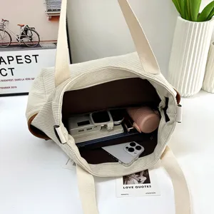 Detailed view showing large capacity and internal storage pockets of the tote bag.