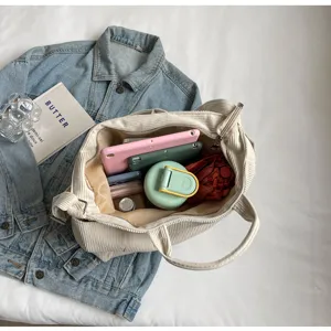 Large capacity corduroy tote bag detail showing spacious interior,casual shoulder handbag style.