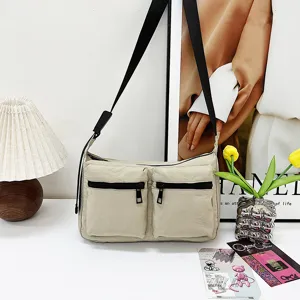 Casual nylon shoulder bag for women, commuter crossbody bag with dual front zipper pockets.