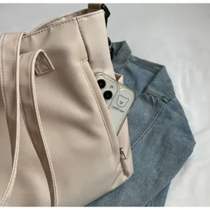 Casual minimalist waterproof nylon tote bag with spacious capacity, perfect for daily wear.