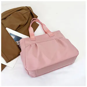 Pink nylon tote bag for women, large capacity shoulder bag for daily commute and casual use.