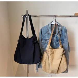 Lightweight nylon shoulder tote bag in black and khaki, casual commuter handbag for daily use.