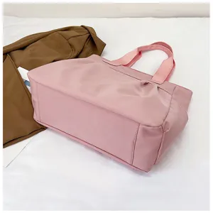 Pink nylon tote bag for women, large capacity casual shoulder bag and stylish commuter handbag.
