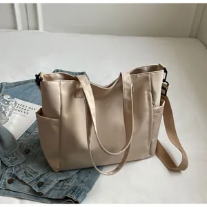 Waterproof nylon tote bag detail featuring large capacity and side pocket design.