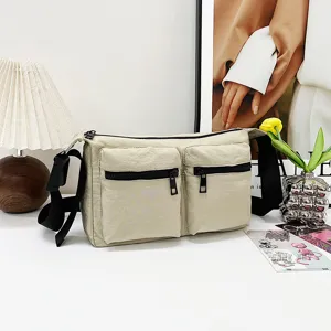 Casual multi-pocket canvas shoulder bag detail view, versatile daily crossbody bag design.