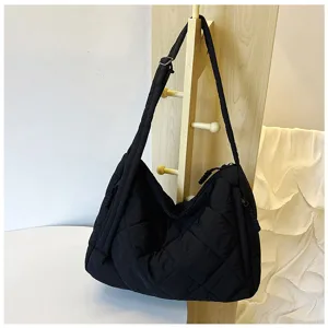 Black quilted nylon shoulder bag casual crossbody tote bag with adjustable strap and zip.