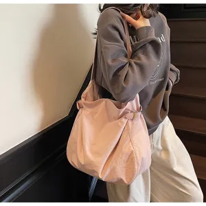 Casual pink nylon shoulder bag, lightweight slouchy tote for daily commuting and office wear.