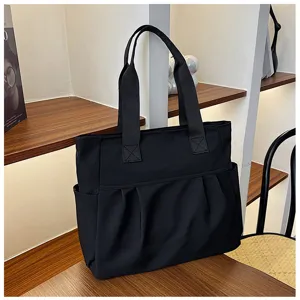 Minimalist black nylon tote bag for women, large capacity shoulder bag for daily commute.