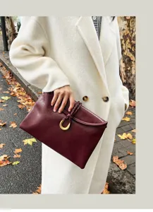 Chic wine red envelope clutch bag for women, soft leather shoulder bag with golden U-shaped hardware.
