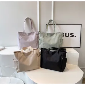 Waterproof nylon tote bag, large capacity casual shoulder bag in solid colors for daily use.