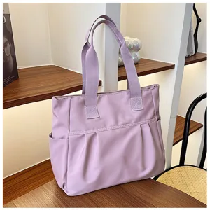 Large capacity purple nylon tote bag, casual commuting shoulder bag with side pockets.