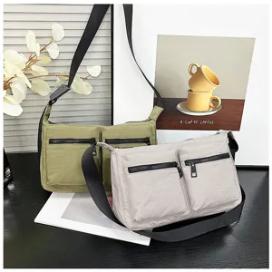 Casual nylon crossbody bag with multi pockets and wide strap, detailed studio shot style.