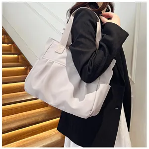 Large capacity nylon tote bag for women, minimalist shoulder bag and casual commuting handbag.