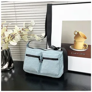 Casual light blue nylon crossbody shoulder bag for women, featuring dual front zipper pockets.