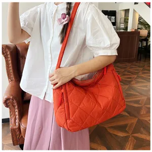 Large capacity nylon quilted shoulder bag, casual orange crossbody tote bag for women daily use.