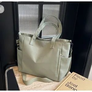 Waterproof nylon tote bag for women, large capacity casual single shoulder crossbody bag style.