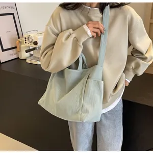 Casual corduroy tote bag detail, featuring large capacity, shoulder and crossbody wear options.
