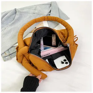 Padded knotted shoulder crossbody tote bag with soft texture, large capacity daily handbag.