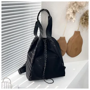 Detailed view of the black multi-functional drawstring backpack, stylish and large capacity.