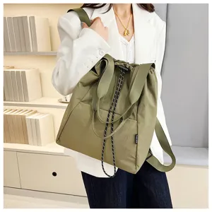 Versatile green canvas backpack for women, stylish drawstring casual shoulder bag with dual handles.