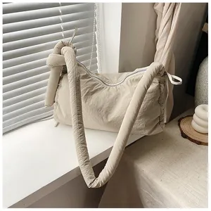 Beige padded tote shoulder bag with knotted strap, soft casual crossbody bag for daily commute.