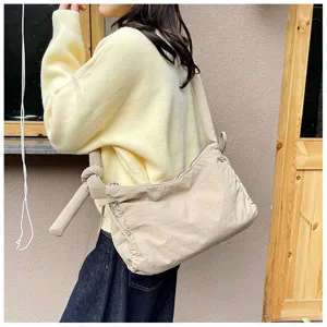 Casual padded shoulder bag for women, soft crossbody tote with chic knot and cute ruffles.