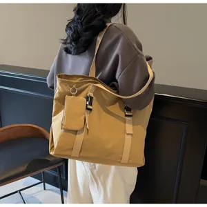 Large capacity canvas tote shoulder bag for women, casual travel bag with small pouch design.