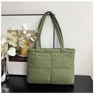 Green quilted nylon tote bag detail, soft padded shoulder bag with classic grid pattern.