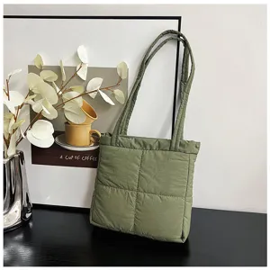 Green quilted nylon tote bag for women, soft puffer shoulder bag with stylish grid design.