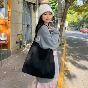 Black suede tote bag for women, retro casual large capacity shoulder bag for daily commuting.