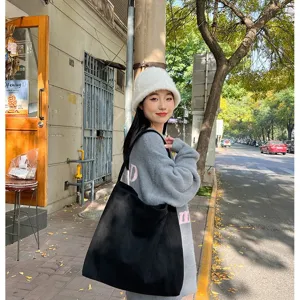 Black suede tote bag for women, large capacity minimalist shoulder bag for daily commute and casual use.
