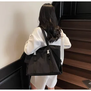 Large capacity black canvas tote bag, casual daily shoulder bag with buckles for women.