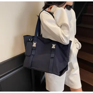 Large capacity casual canvas tote bag for women, stylish shoulder bag with buckle straps and pouch.